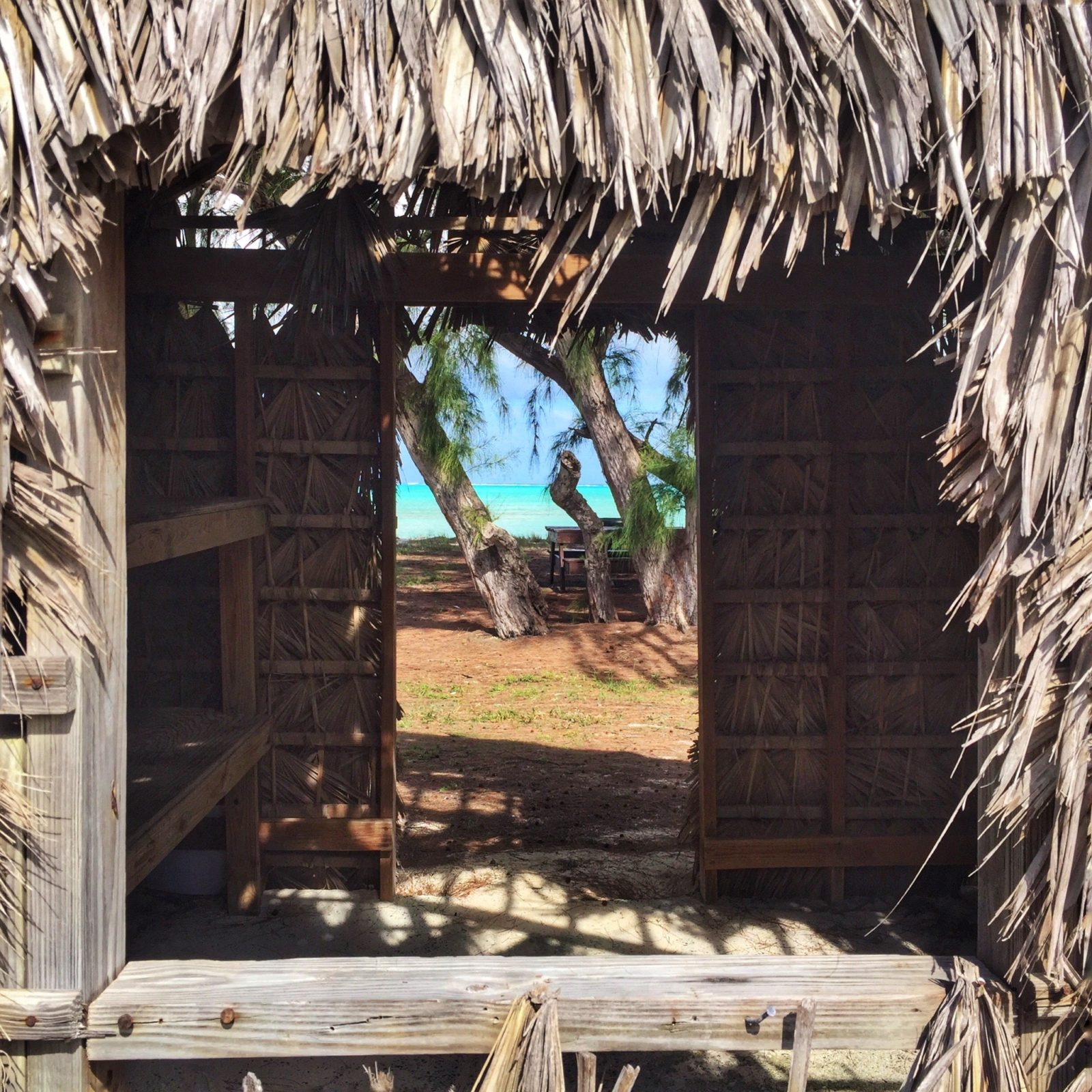 Through the tiki hut, a view of Bambara Beach.